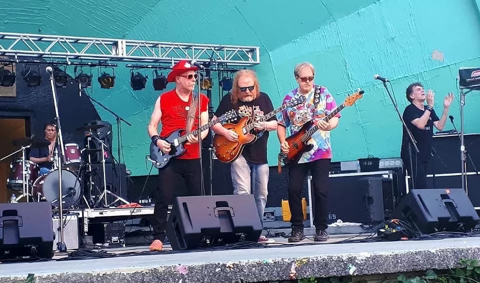 The Shakers performing outdoors on stage